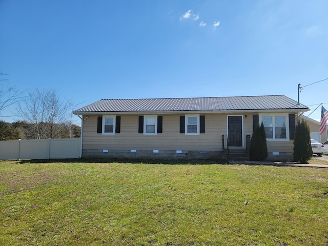 view of front facade featuring crawl space, metal roof, a front lawn, and fence