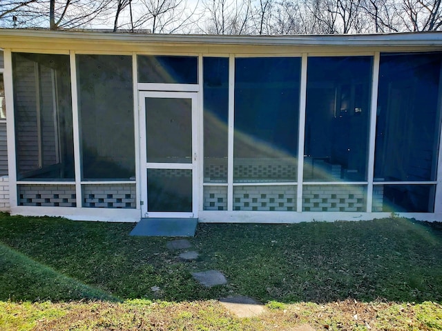 view of side of property with brick siding