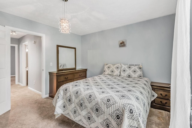 carpeted bedroom with baseboards