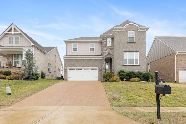 traditional home with driveway, a front lawn, a garage, brick siding, and central AC unit