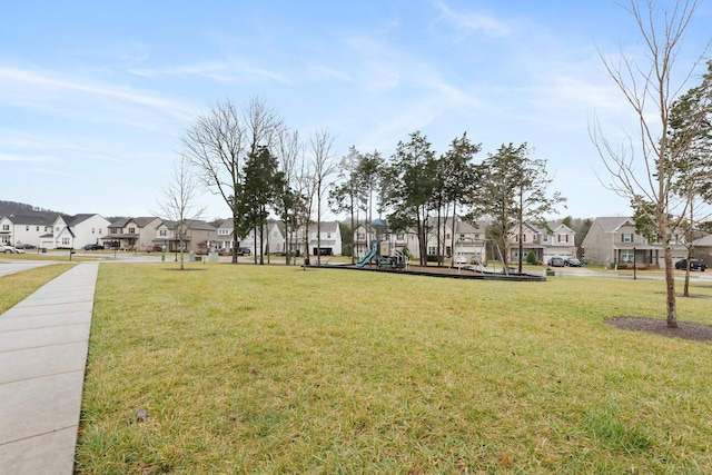 view of yard with playground community and a residential view