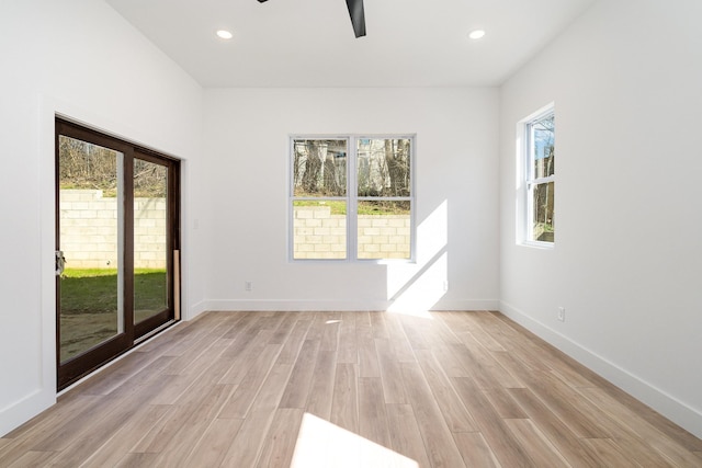 spare room with recessed lighting, baseboards, light wood-style floors, and ceiling fan