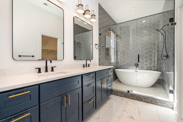 full bath featuring visible vents, double vanity, a soaking tub, a sink, and marble finish floor