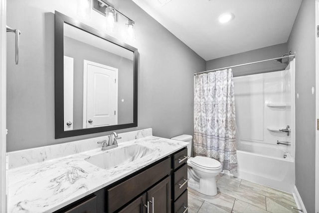 bathroom with shower / tub combo, toilet, and vanity