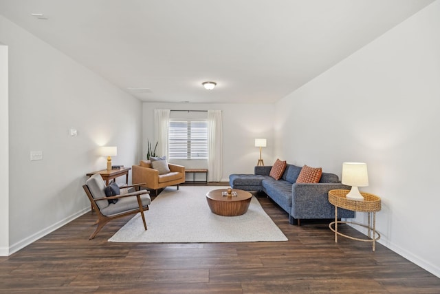 living room featuring baseboards and wood finished floors