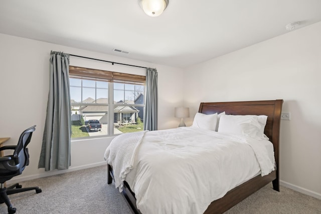 bedroom featuring visible vents, carpet floors, and baseboards