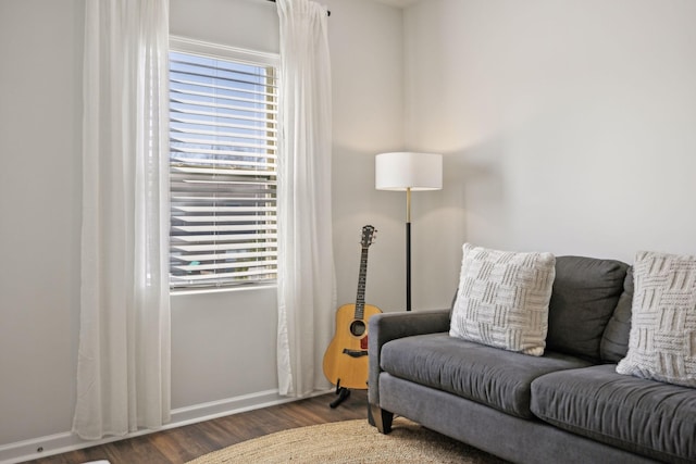 sitting room featuring baseboards and wood finished floors