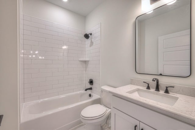 bathroom with toilet, vanity, and shower / tub combination