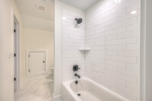 bathroom with visible vents, baseboards, bathing tub / shower combination, toilet, and marble finish floor