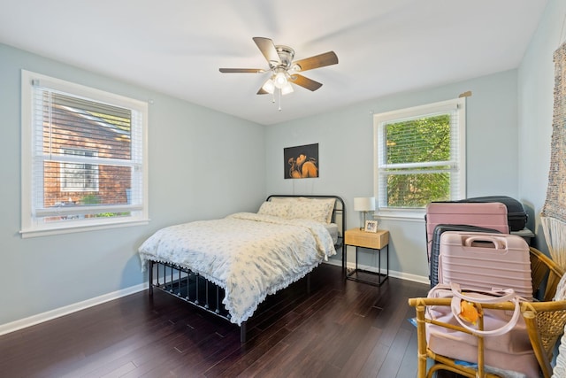 bedroom with ceiling fan, baseboards, and wood finished floors