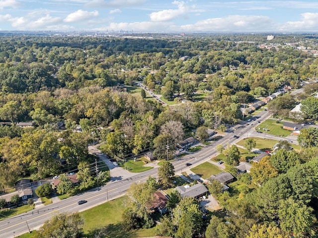 birds eye view of property with a wooded view