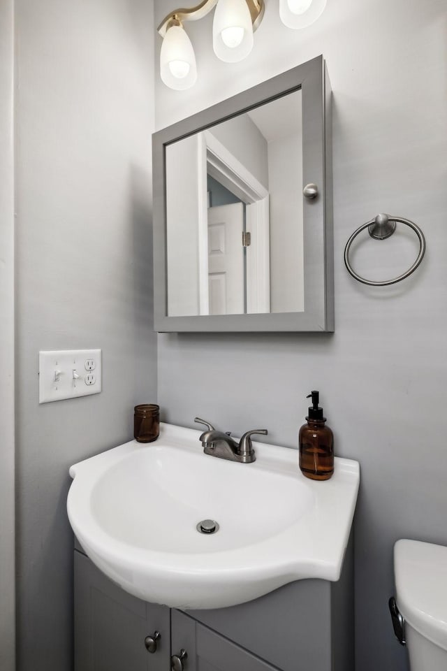 half bath with toilet and vanity