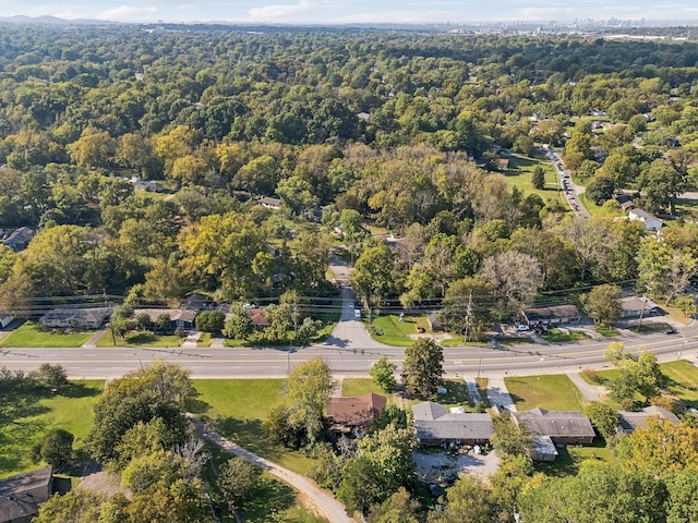 birds eye view of property with a wooded view