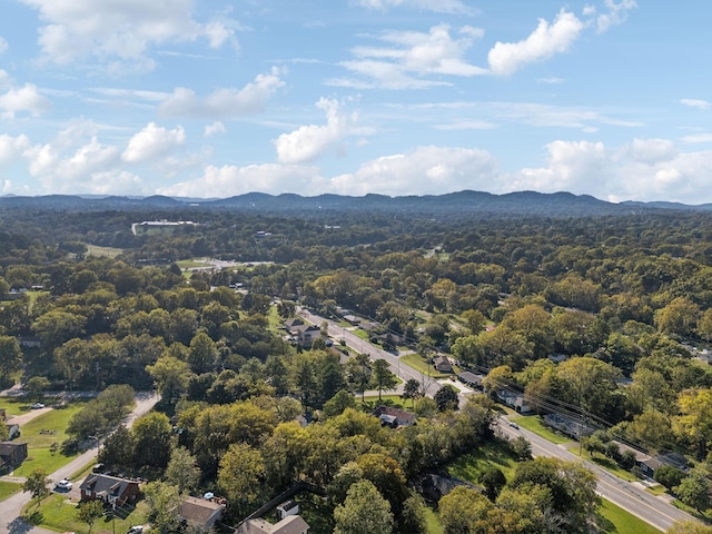 aerial view featuring a mountain view and a view of trees