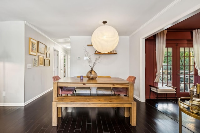 dining space with wood finished floors, baseboards, french doors, and ornamental molding