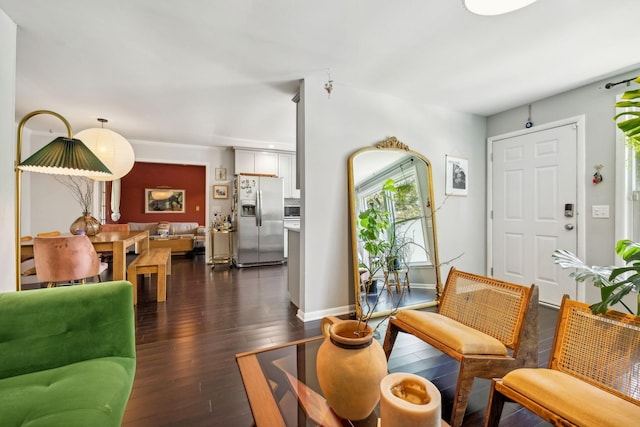 living room featuring baseboards and dark wood-style floors