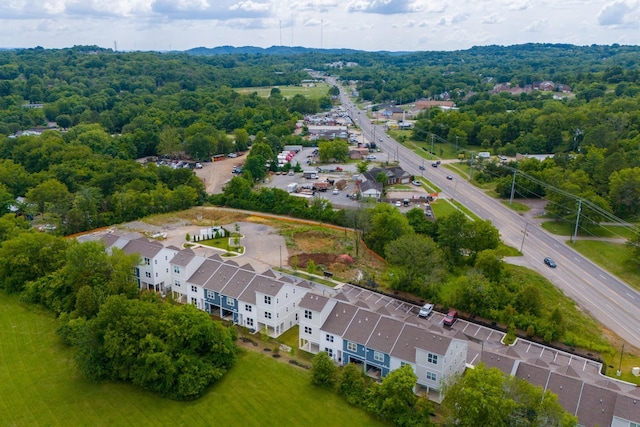 bird's eye view featuring a wooded view