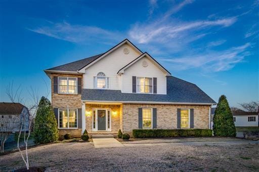 view of front of home featuring brick siding