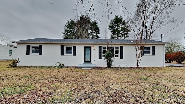 single story home featuring crawl space, a front lawn, and brick siding