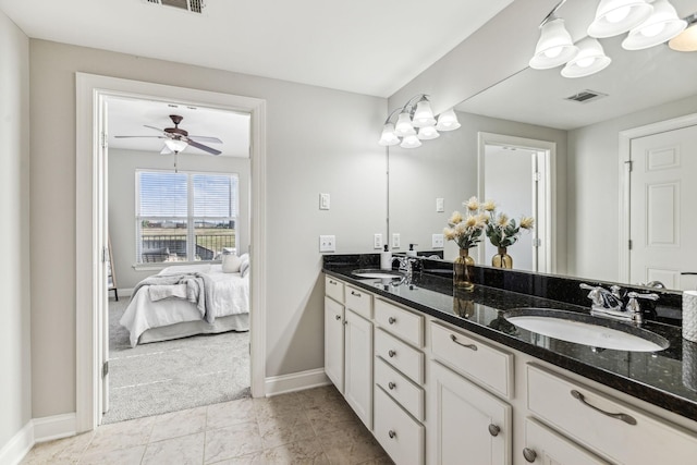 bathroom featuring double vanity, visible vents, ensuite bathroom, and a sink