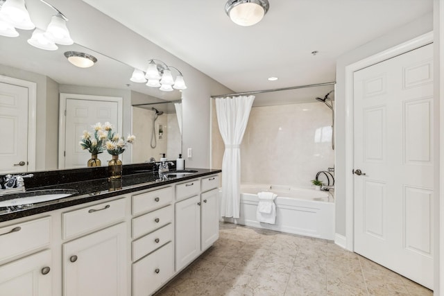 full bathroom featuring double vanity, shower / bath combination with curtain, and a sink