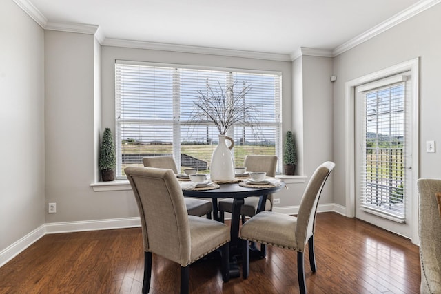 dining area with baseboards, ornamental molding, and dark wood-style flooring