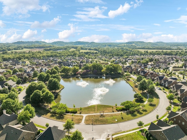 drone / aerial view with a water view and a residential view