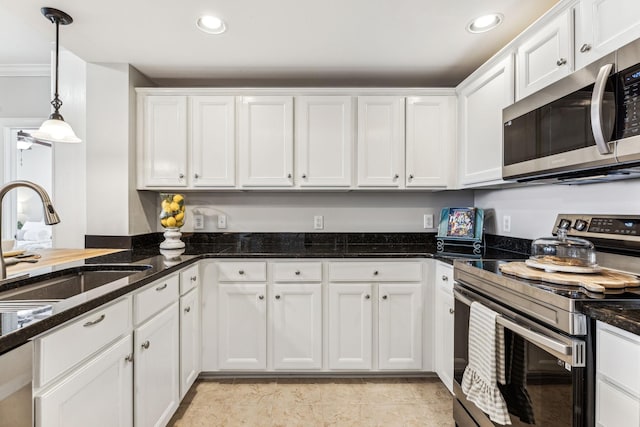 kitchen featuring a sink, decorative light fixtures, white cabinetry, recessed lighting, and stainless steel appliances