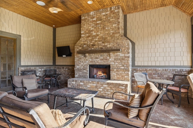 view of patio / terrace with an outdoor brick fireplace