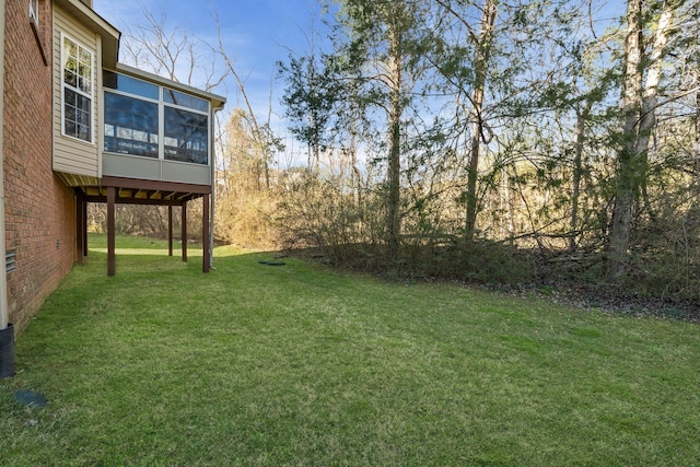 view of yard with a sunroom