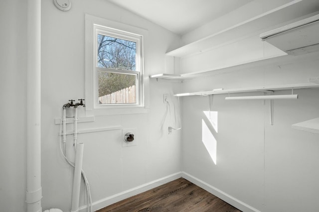 laundry area featuring washer hookup, laundry area, baseboards, attic access, and dark wood-style flooring