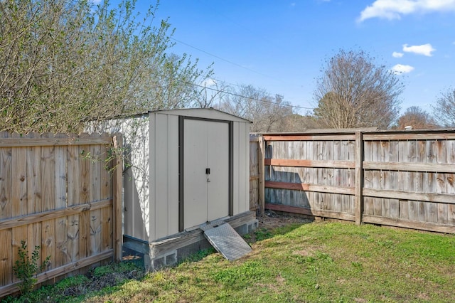 view of shed with a fenced backyard