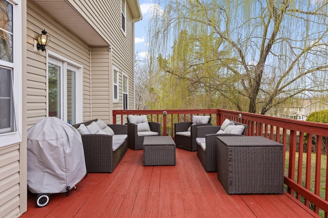 wooden terrace featuring outdoor lounge area