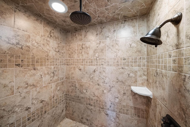 full bathroom with a tile shower