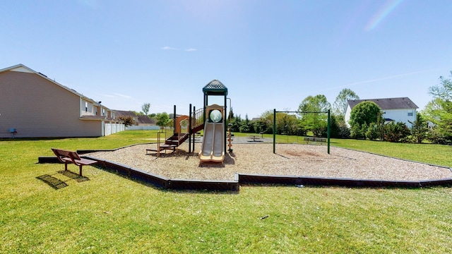 communal playground featuring a yard