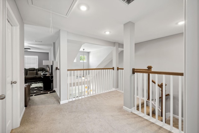 hall with recessed lighting, baseboards, carpet floors, and attic access