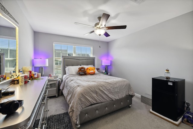 bedroom with carpet flooring, baseboards, and ceiling fan