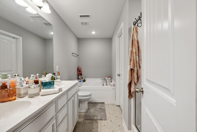 bathroom with visible vents, a garden tub, toilet, a sink, and double vanity