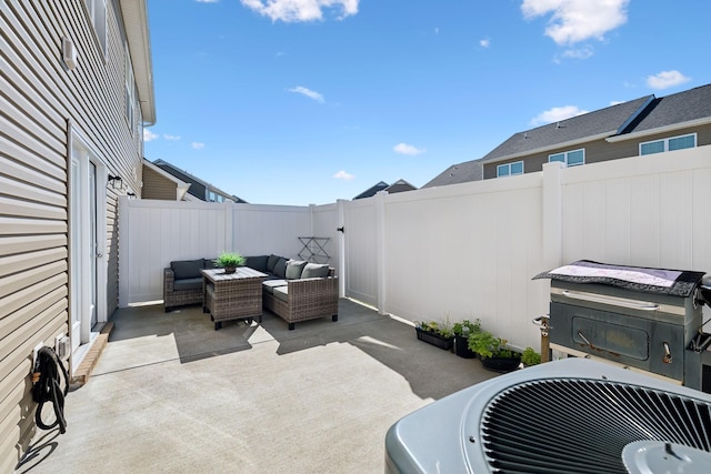 view of patio / terrace with area for grilling, an outdoor hangout area, and a fenced backyard