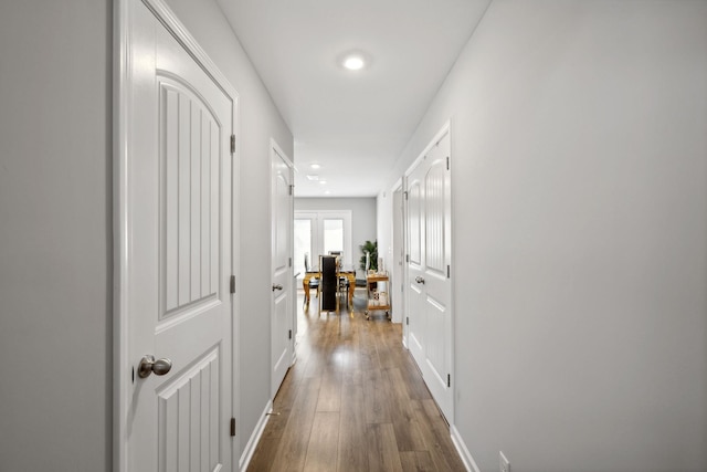 hall with wood finished floors