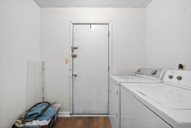 washroom featuring laundry area, dark wood-style floors, and separate washer and dryer