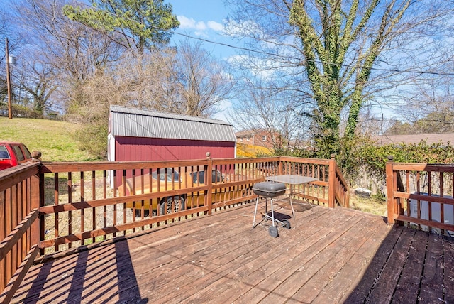 deck featuring a storage shed and an outdoor structure