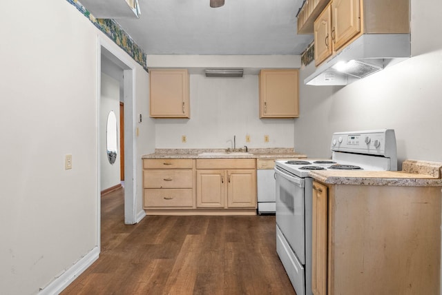 kitchen with white appliances, light brown cabinets, a sink, light countertops, and under cabinet range hood