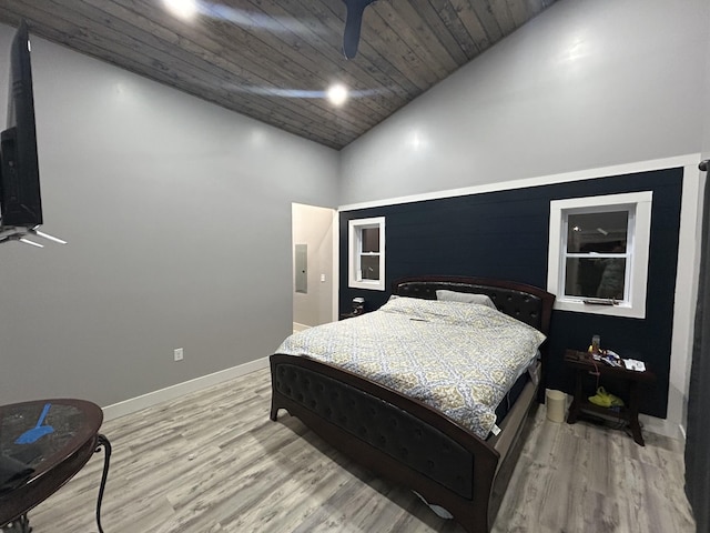 bedroom with baseboards, wood ceiling, electric panel, light wood-style flooring, and high vaulted ceiling