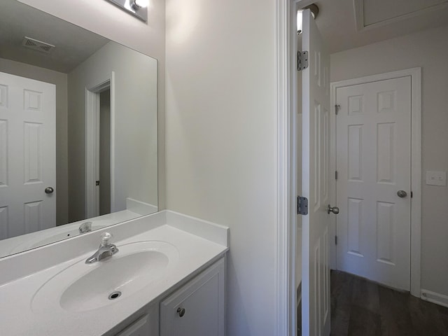 bathroom featuring vanity and visible vents