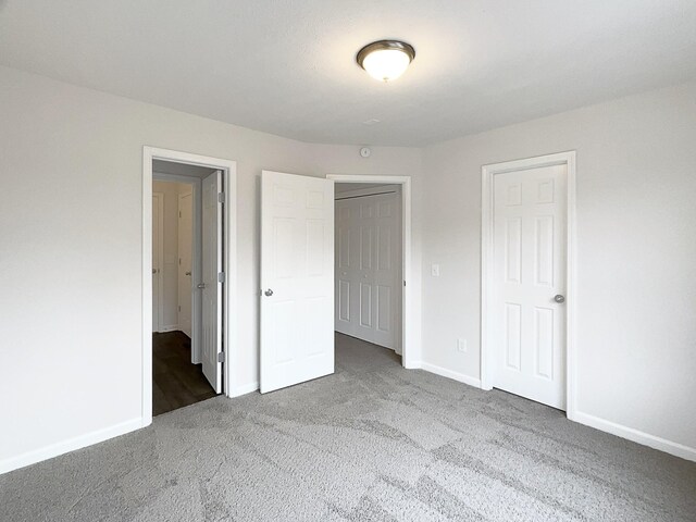 9004 Nathanael Dr, La Vergne, TN 37086 - unfurnished bedroom featuring carpet floors and baseboards