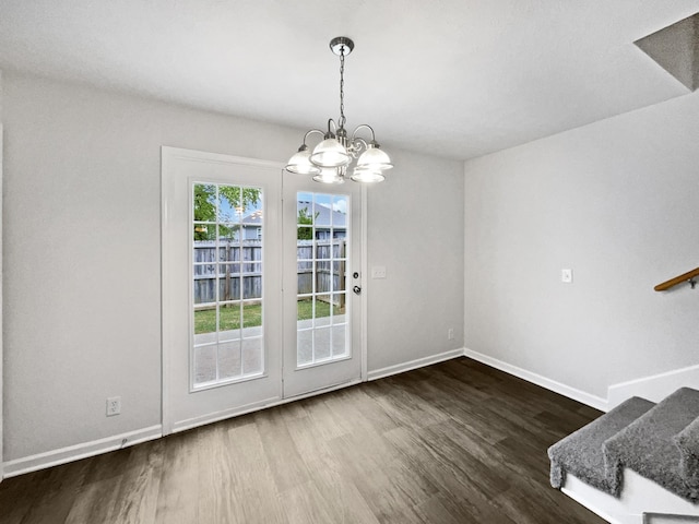 9004 Nathanael Dr, La Vergne, TN 37086 - doorway featuring wood finished floors, baseboards, a chandelier, and stairs