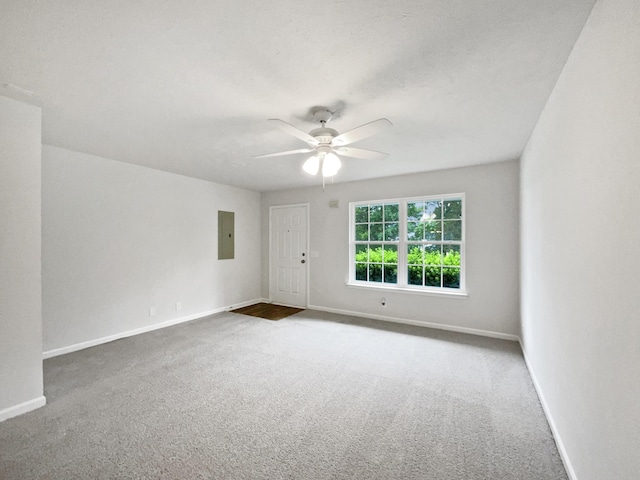 9004 Nathanael Dr, La Vergne, TN 37086 - empty room with electric panel, a ceiling fan, carpet, and baseboards