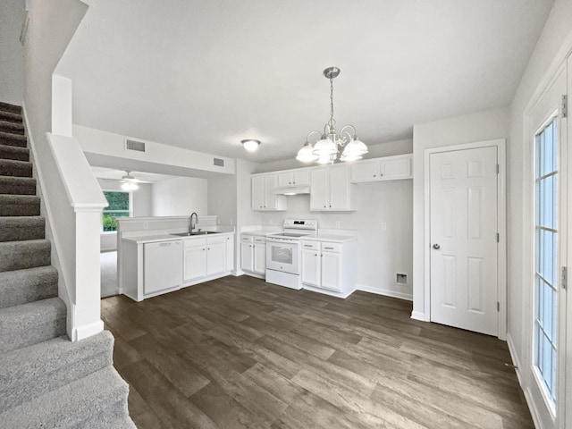 9004 Nathanael Dr, La Vergne, TN 37086 - kitchen featuring white appliances, a peninsula, open floor plan, dark wood-style flooring, and light countertops