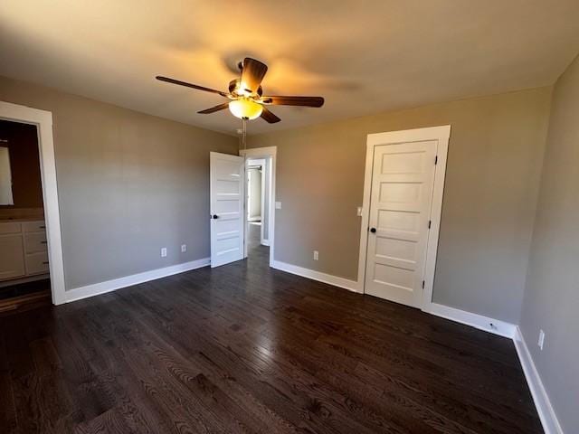 unfurnished bedroom with dark wood finished floors, baseboards, and ceiling fan